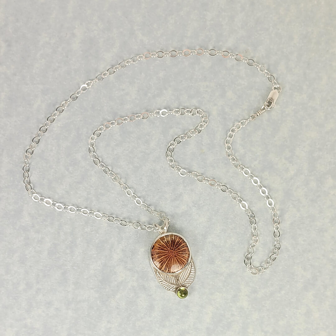 Fossil coral agate flower necklace in sterling silver with peridot