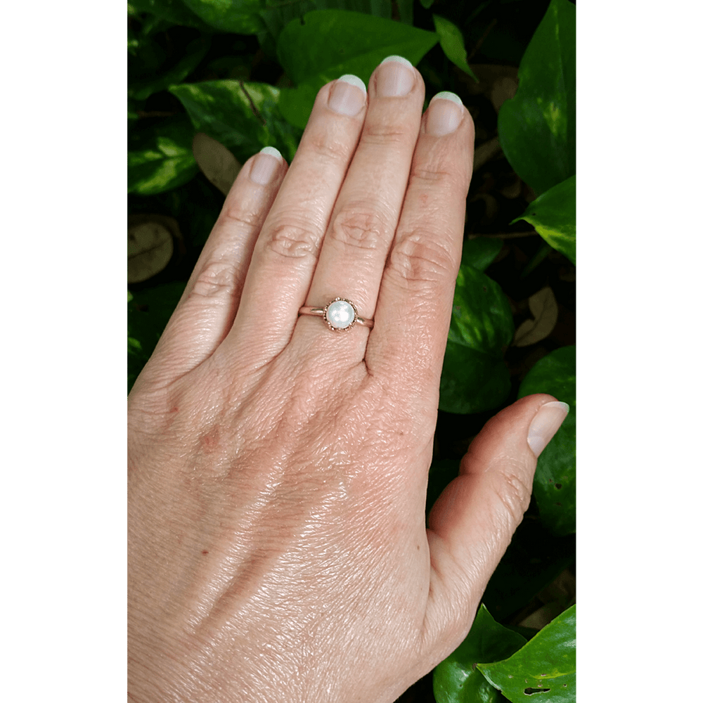 Pearl engagement ring in 14kt gold heart-crown setting