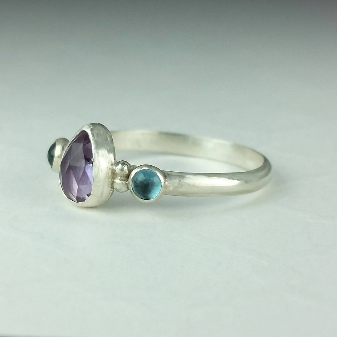 Pear-shaped amethyst ring with London blue topaz in sterling silver