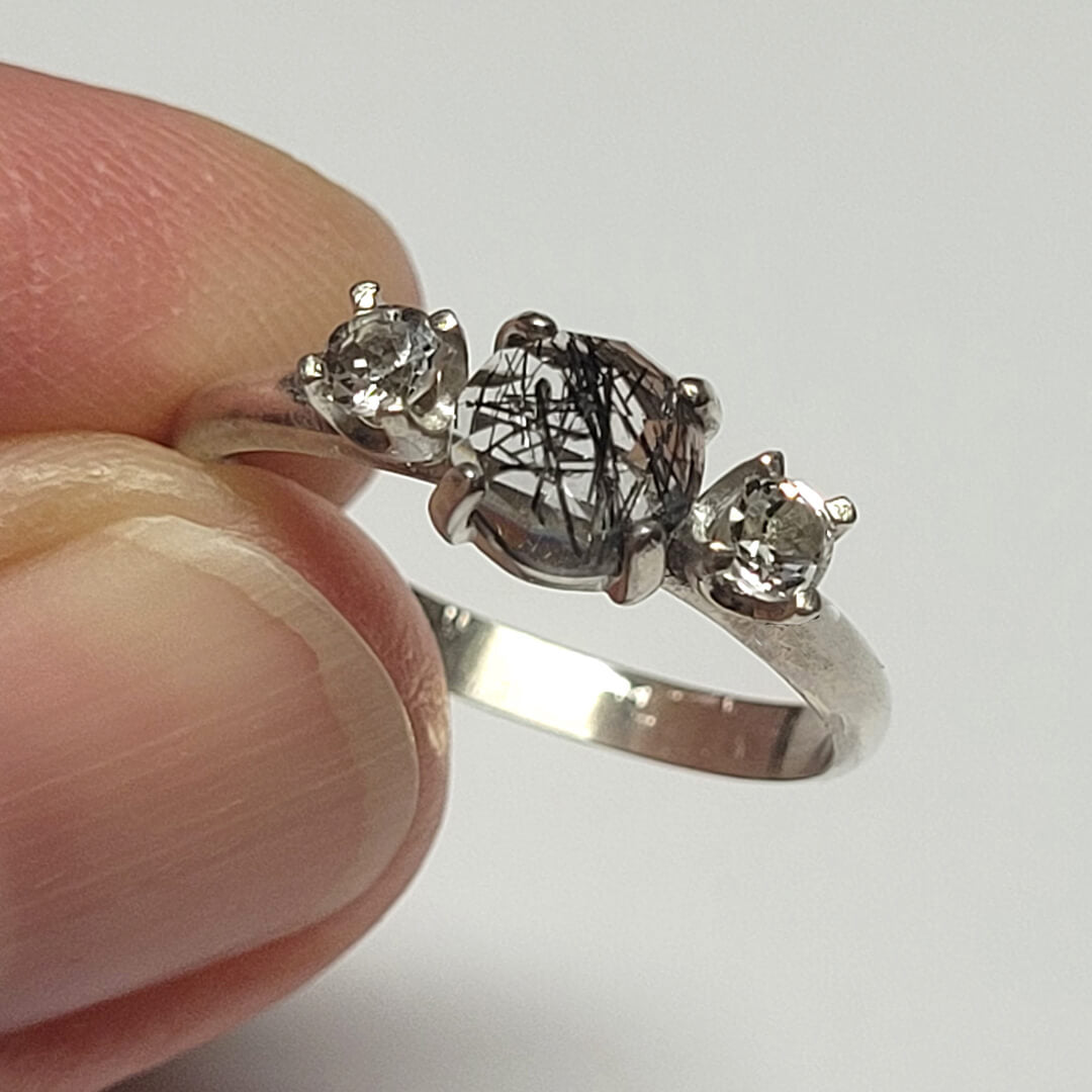 black rutilated quartz ring with white topaz