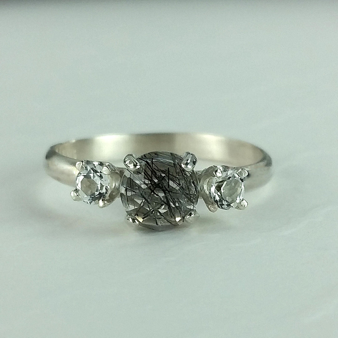 Black rutilated quartz ring with white topaz in sterling silver