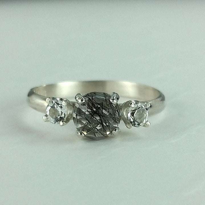 Black rutilated quartz ring with white topaz in sterling silver