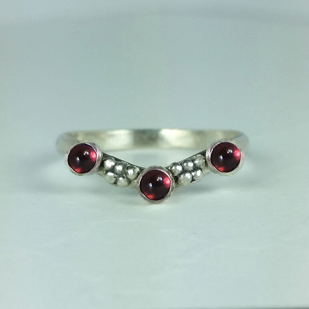 Curved ring band with garnets sterling silver