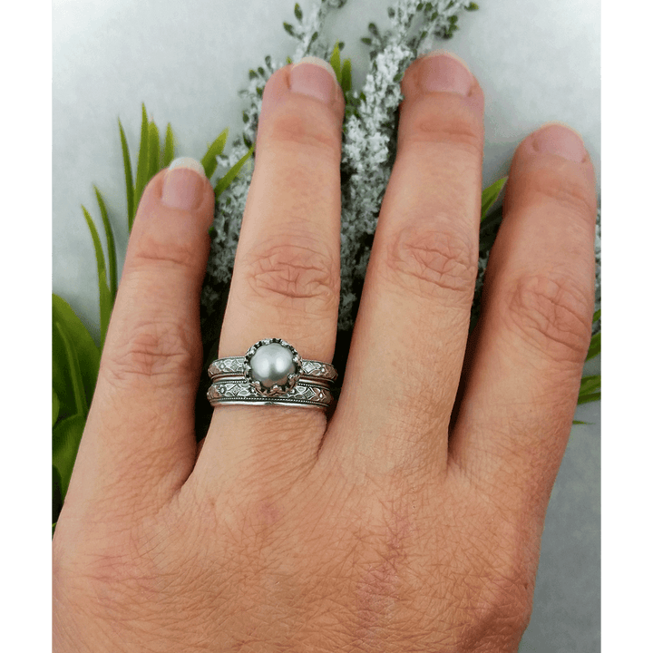 Edwardian style gray pearl engagement ring and wedding band set on model 