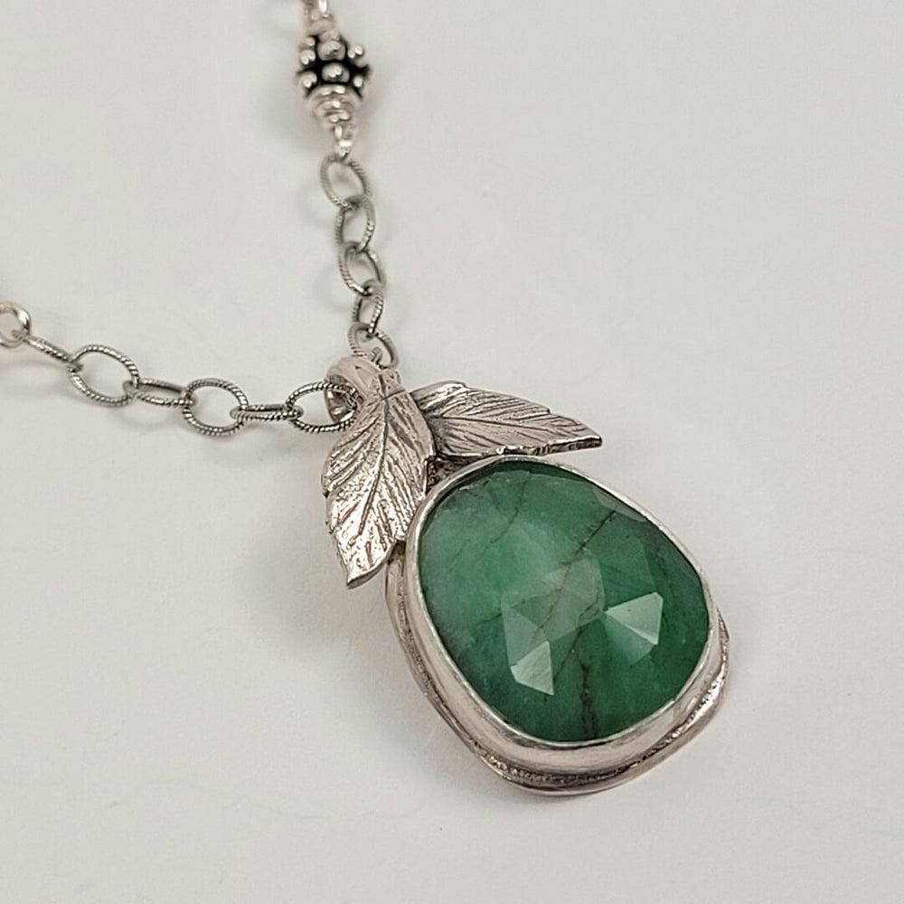 faceted raw emerald necklace with leaves