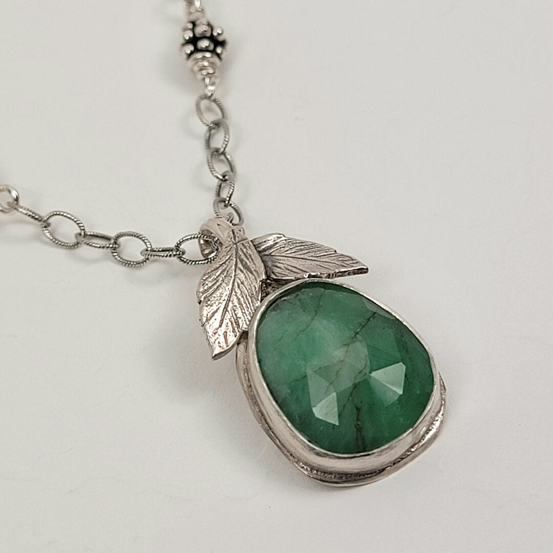 faceted raw emerald necklace with leaves