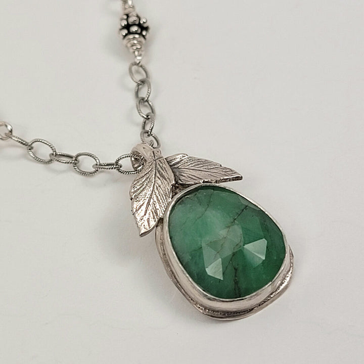 faceted raw emerald necklace with leaves