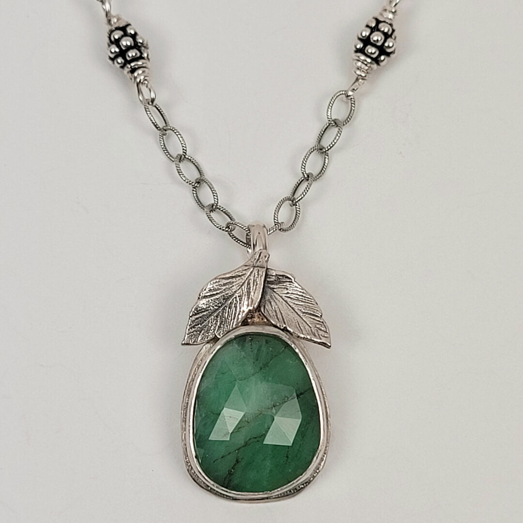 raw emerald necklace with leaves in sterling silver