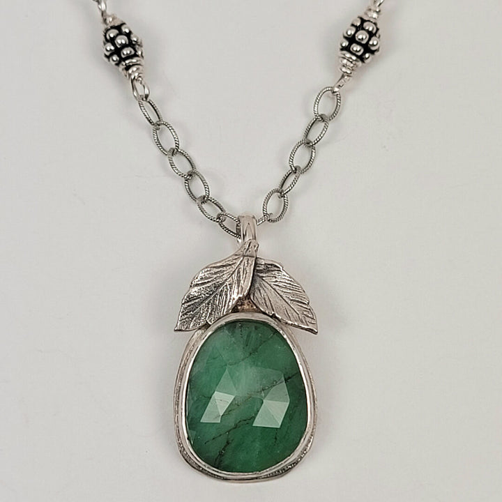 raw emerald necklace with leaves in sterling silver