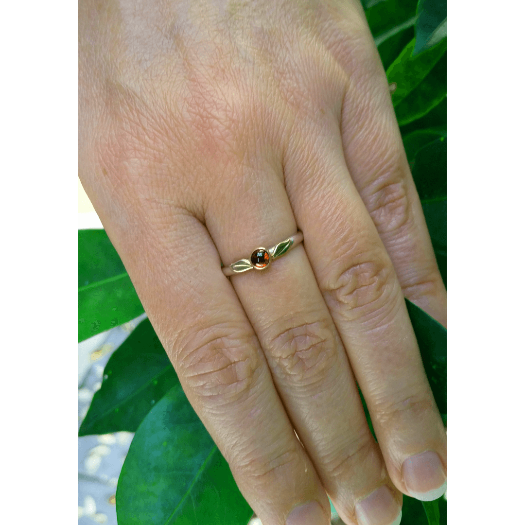 nature-inspired garnet ring with 14kt gold leaves