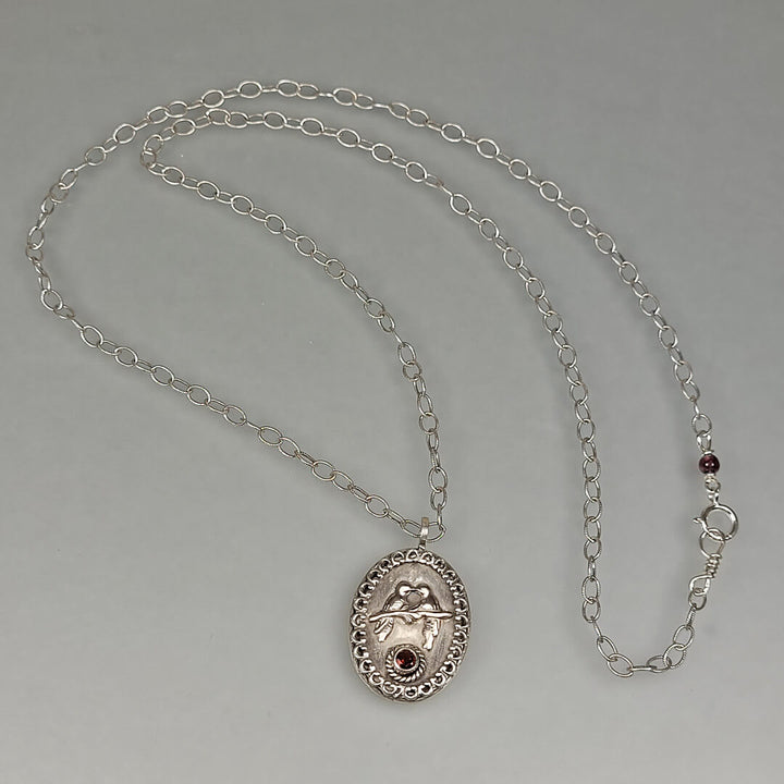 sterling silver love birds necklace with garnet