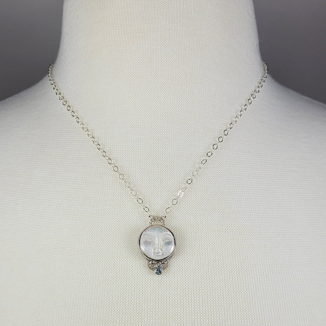 mother of pearl moon face necklace with aquamarine in sterling silver