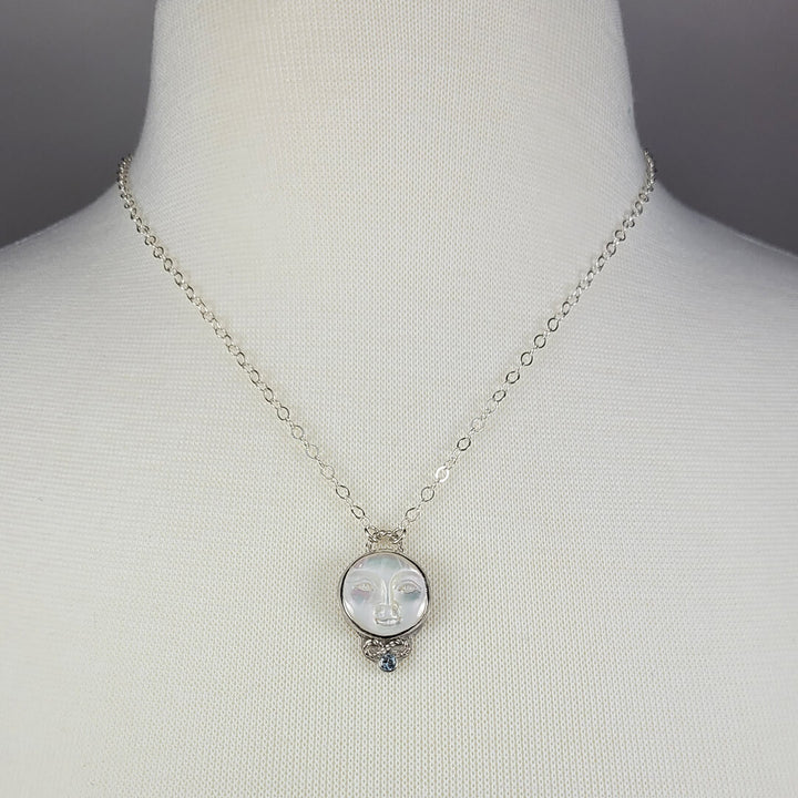 mother of pearl moon face necklace with aquamarine in sterling silver