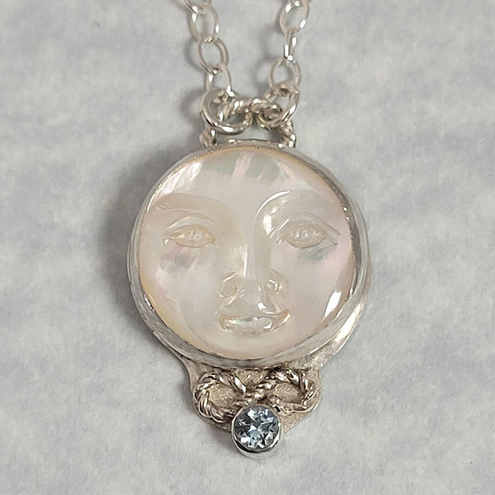 mother of pearl moon face necklace with aquamarine in sterling silver