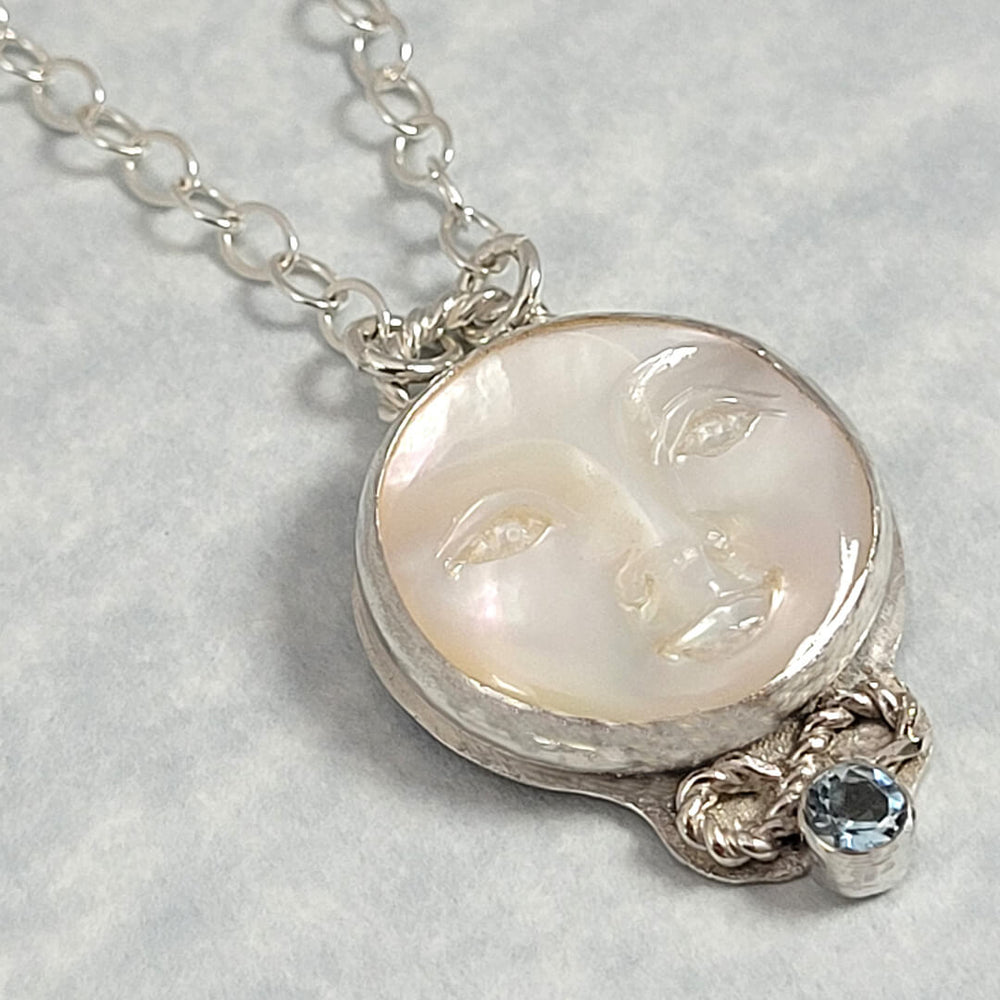 mother of pearl moon face necklace with aquamarine in sterling silver