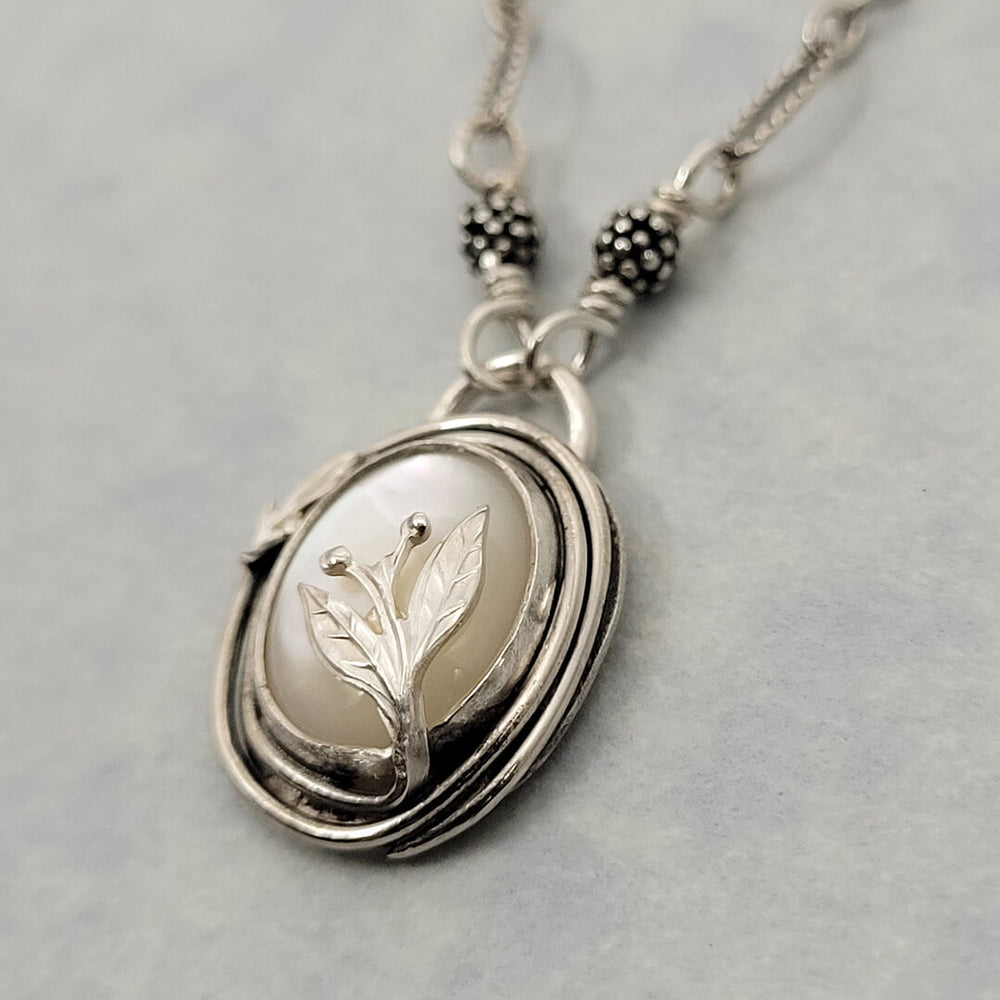 nature-inspired mother of pearl necklace with leaves in sterling silver