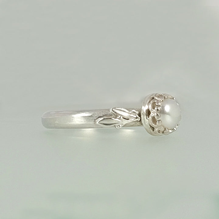 Pearl engagement ring with leaves in sterling silver