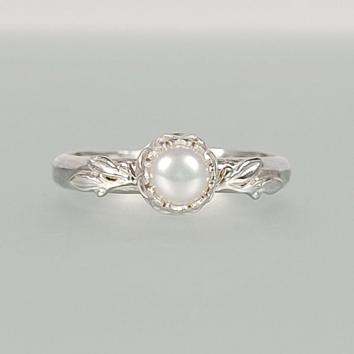 Pearl engagement ring with leaves in sterling silver