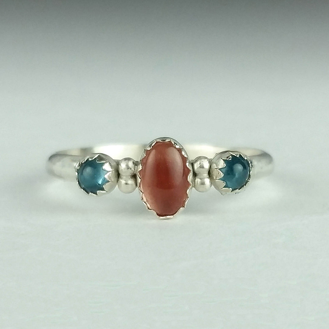 Peach Oregon sunstone Ring with London blue topaz in sterling silver