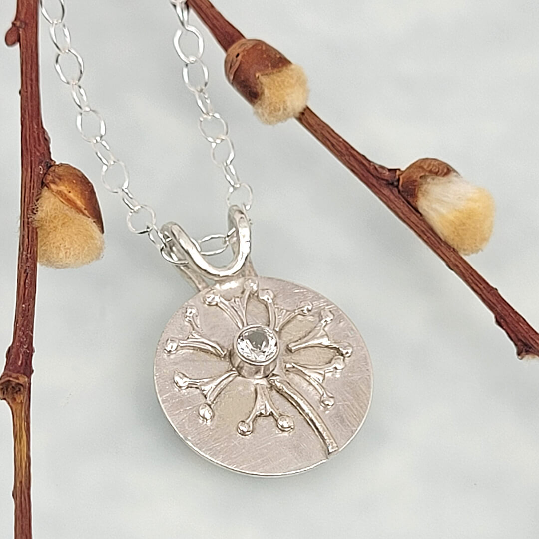 Wish dandelion necklace in sterling silver with white topaz
