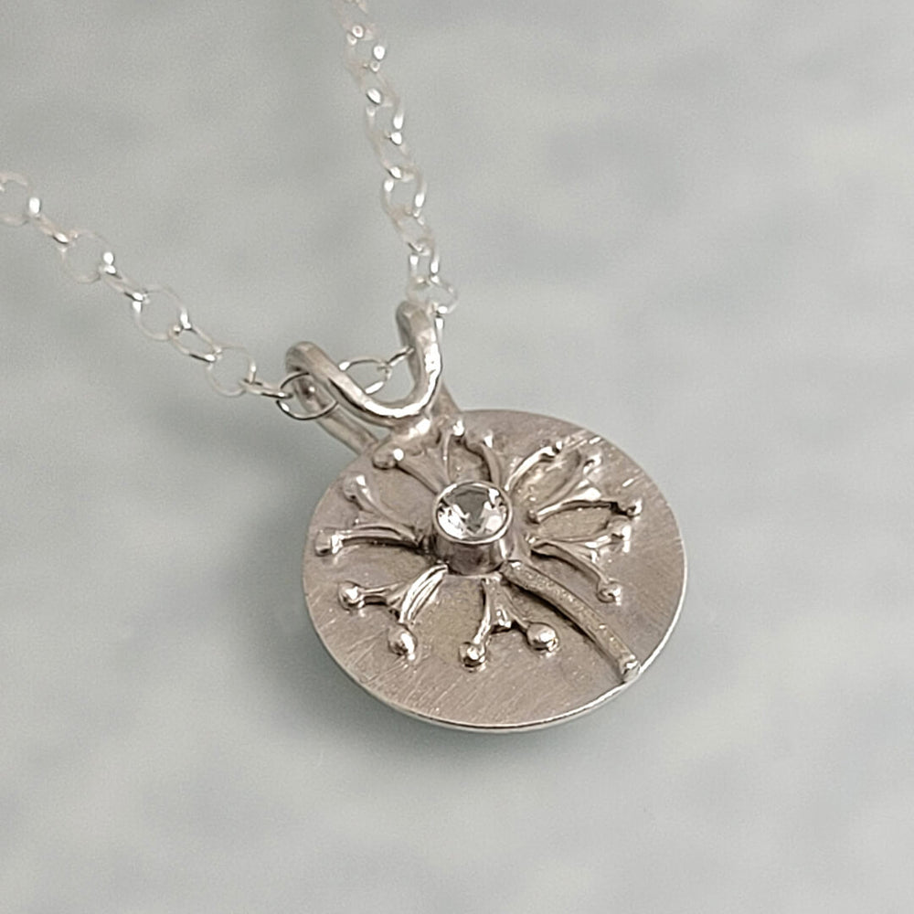 Wish dandelion necklace in sterling silver with white topaz