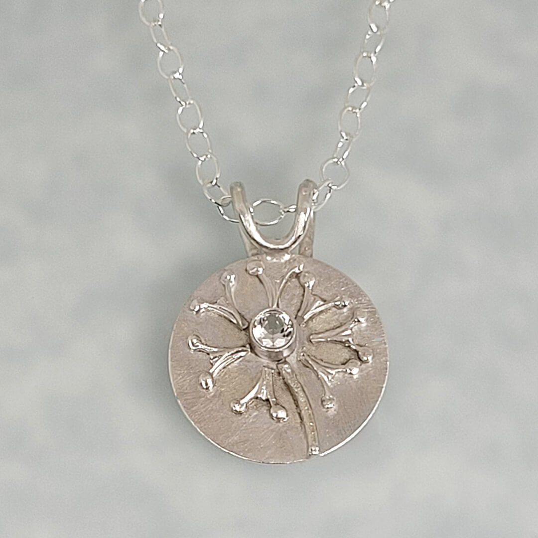Wish dandelion necklace in sterling silver with white topaz