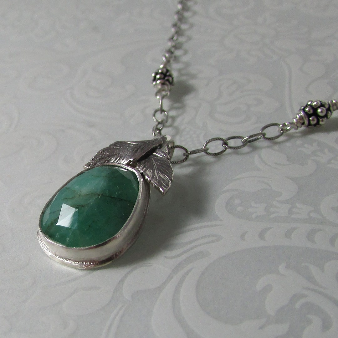 faceted raw emerald necklace with leaves
