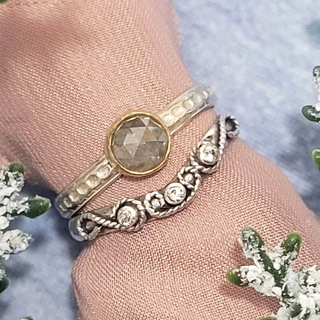 Vintage-inspired rose cut gray diamond ring and white sapphire scrollwork curved wedding band