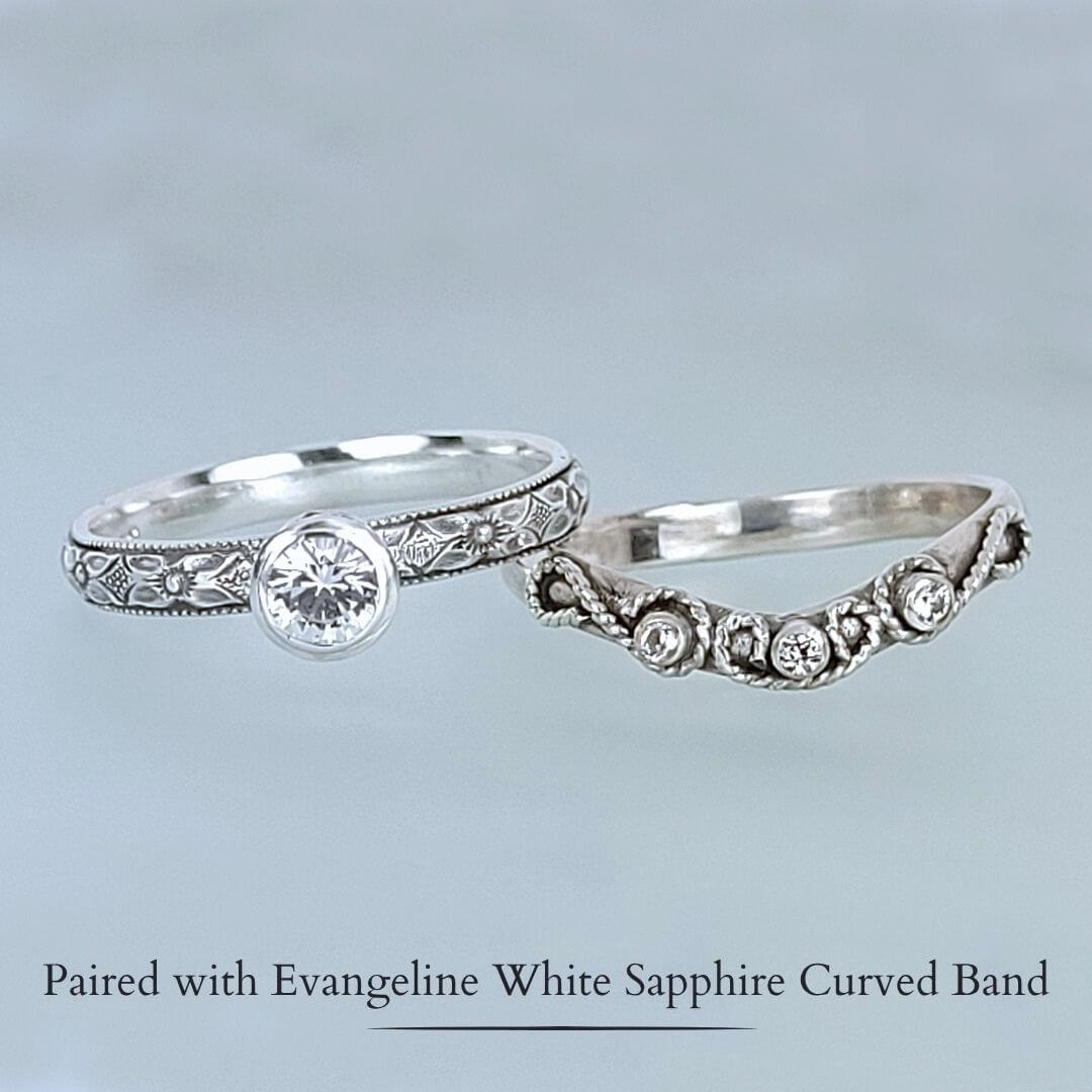 Edwardian-inspired vintage style white sapphire engagement ring and scrollwork white sapphire curved wedding band set in sterling silver