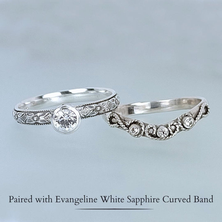 Edwardian-inspired vintage style white sapphire engagement ring and scrollwork white sapphire curved wedding band set in sterling silver