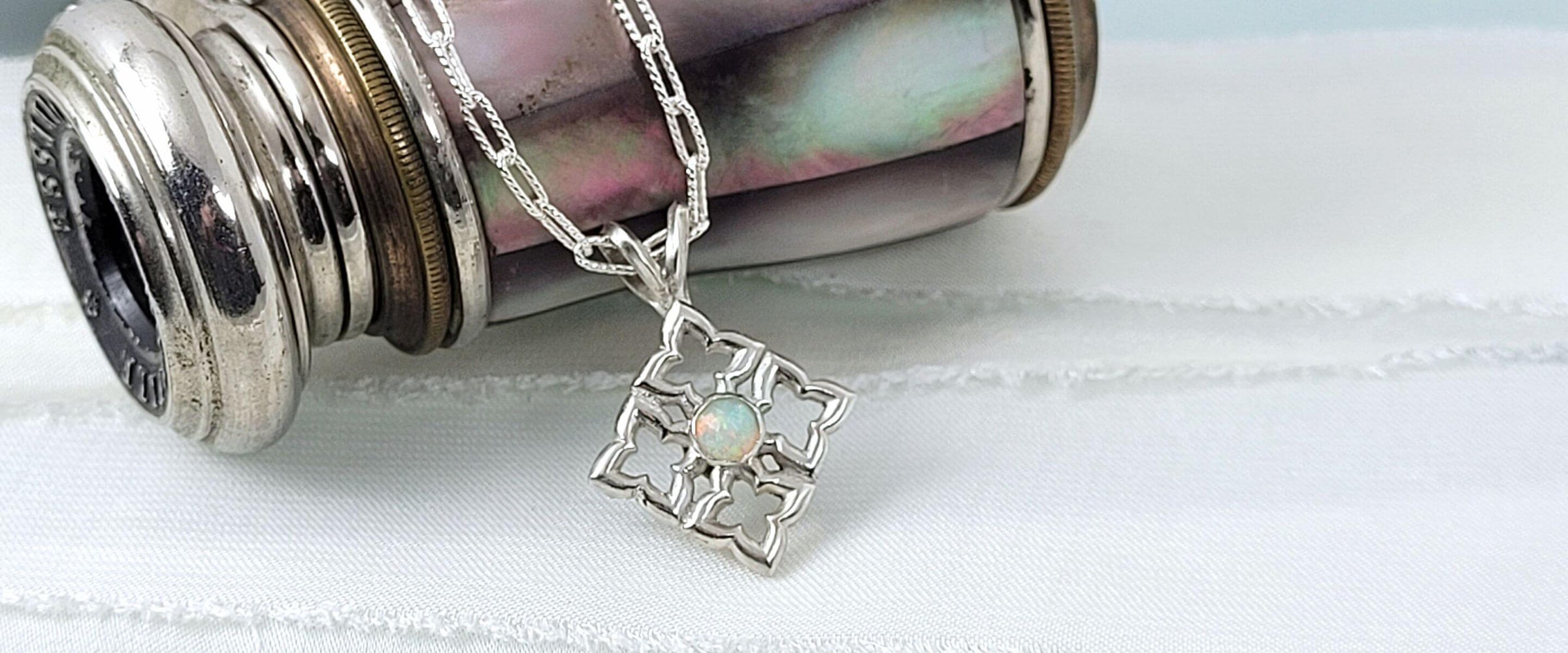 Sterling silver quatrefoil necklace set with opal 