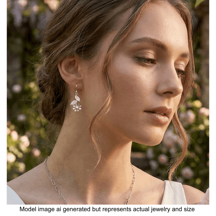 white wild flower earrings in sterling silver dangling from model&