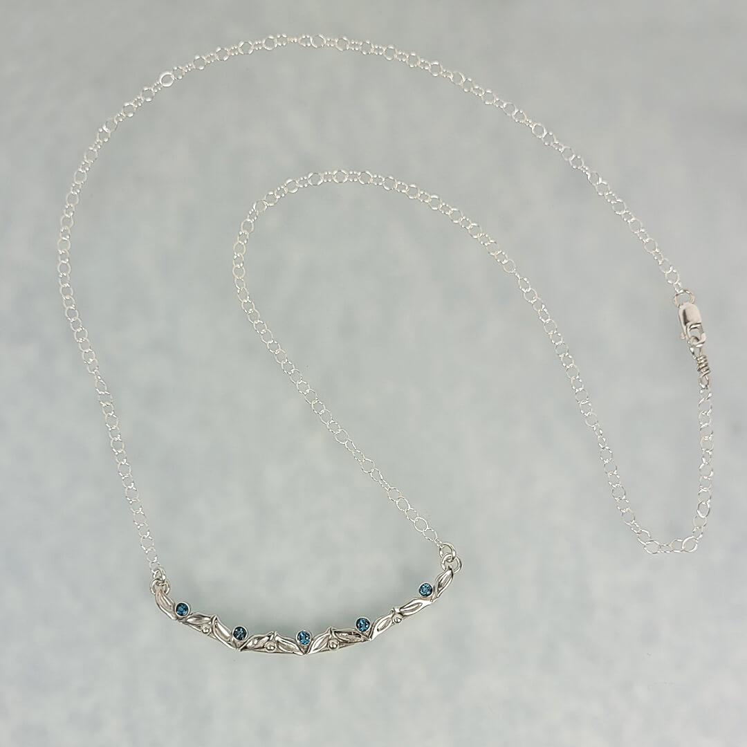 Curved Vine and Leaf Necklace with London Blue Topaz in Sterling Silver