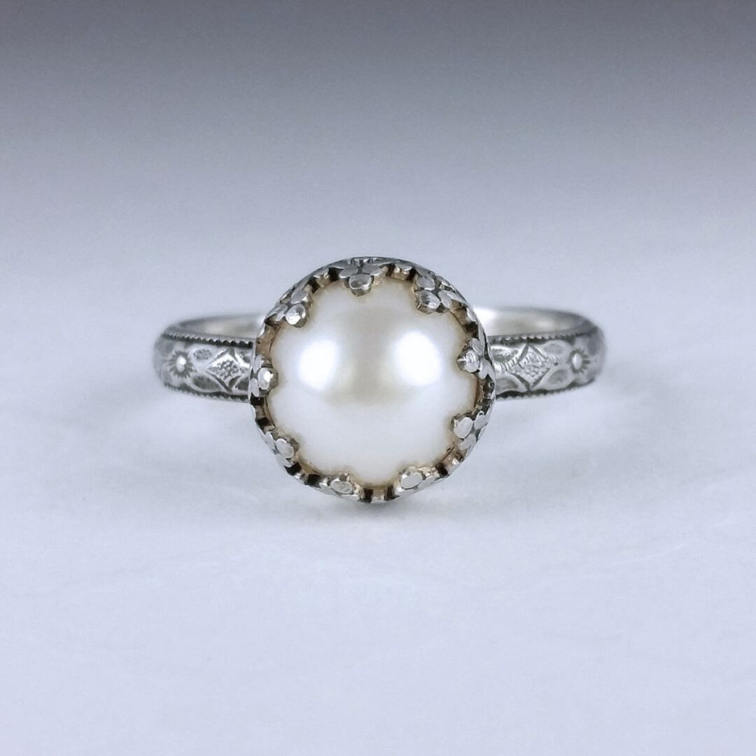 Edwardian vintage style pearl engagement ring with floral band in sterling silver