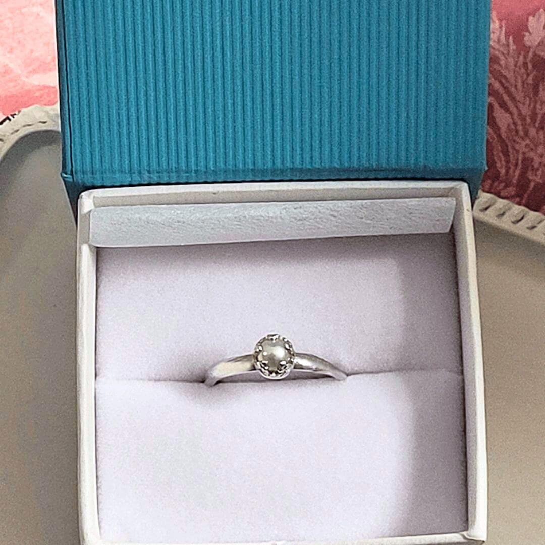 pearl solitaire engagement ring in jewel box