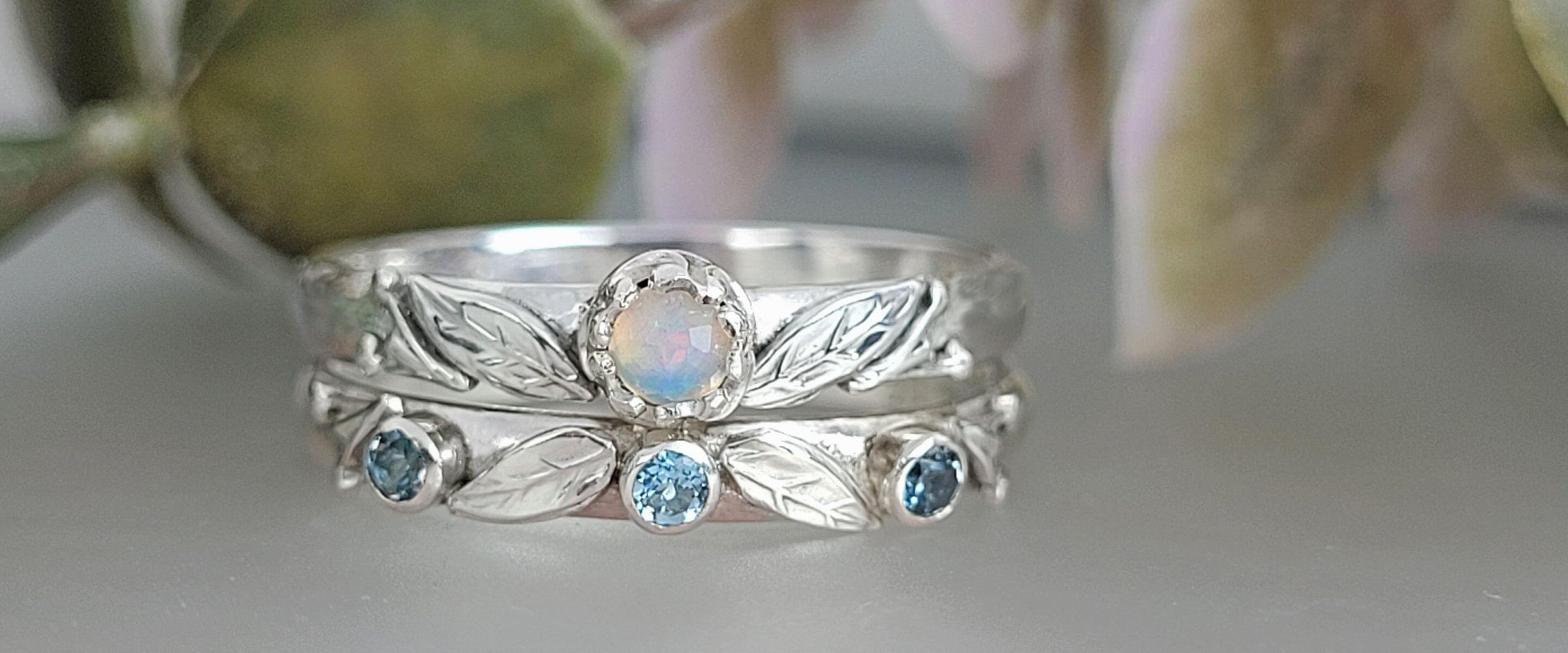 Nature-inspired willow leaf opal engagement ring and blue topaz willow leaf wedding band in sterling silver 