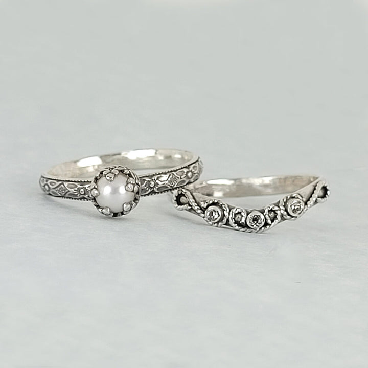 vintage style pearl engagement ring and scrollwork curved wedding band with white sapphires set in sterling silver