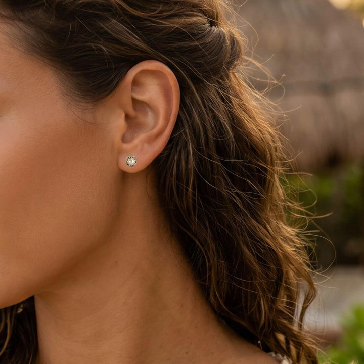 small pearl stud earrings in sterling silver on model