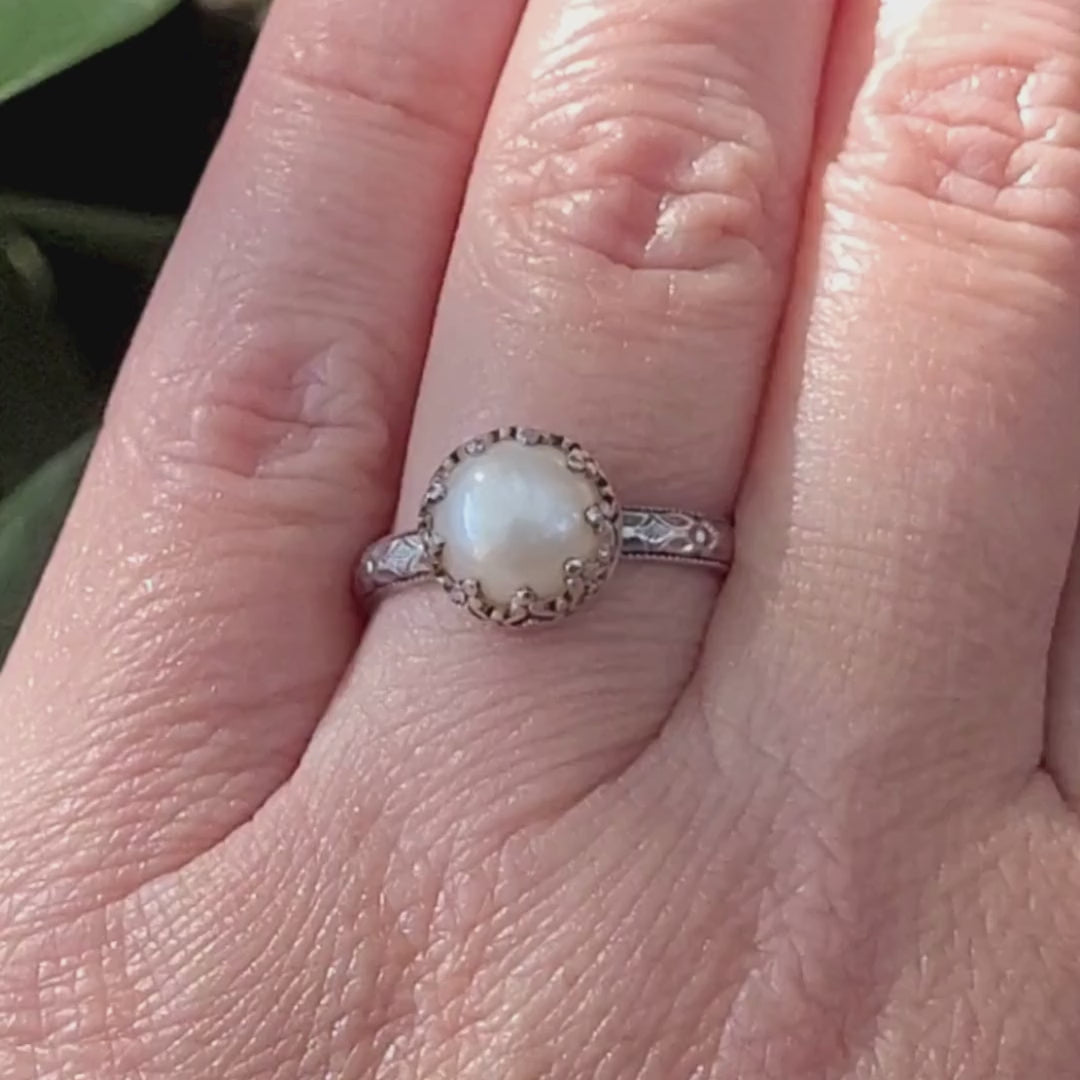 Edwardian style pearl engagement ring with floral band