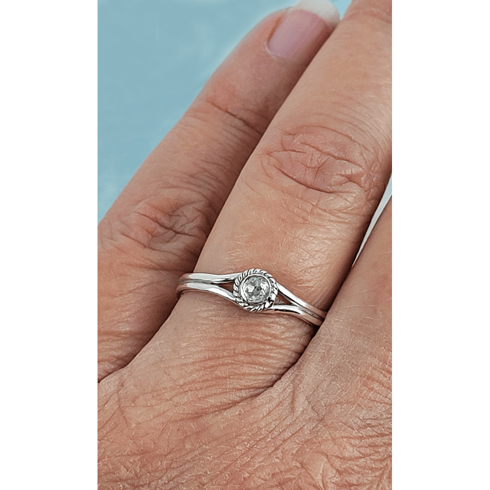 Rustic rose cut white diamond engagement ring in sterling silver on finger
