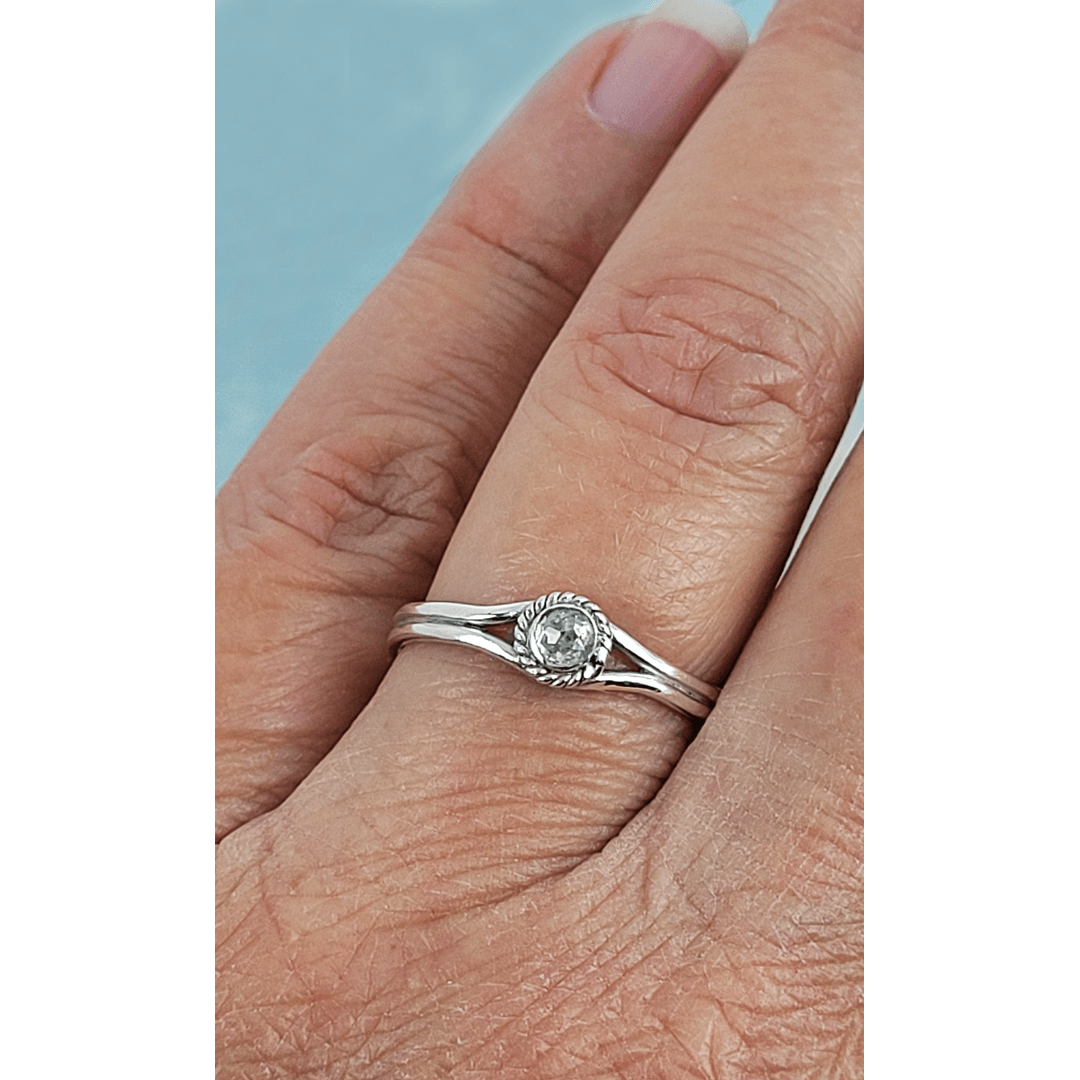 Rustic rose cut white diamond engagement ring in sterling silver on finger