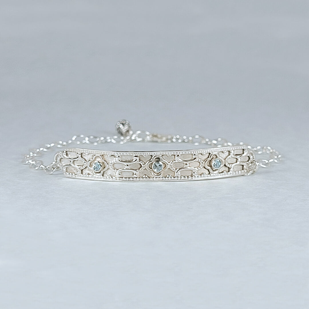 Art deco inspired sterling silver bar bracelet set with Swiss blue topaz