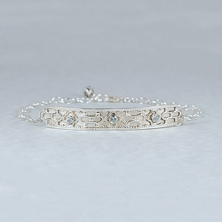 Art deco inspired sterling silver bar bracelet set with Swiss blue topaz