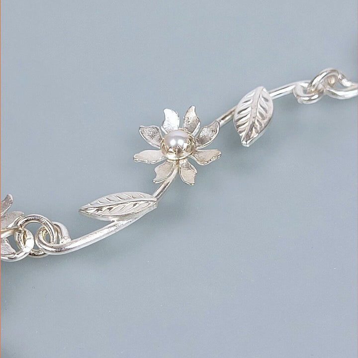 close-up of detail of Wildflower Vine Necklace in Sterling Silver with Pearls