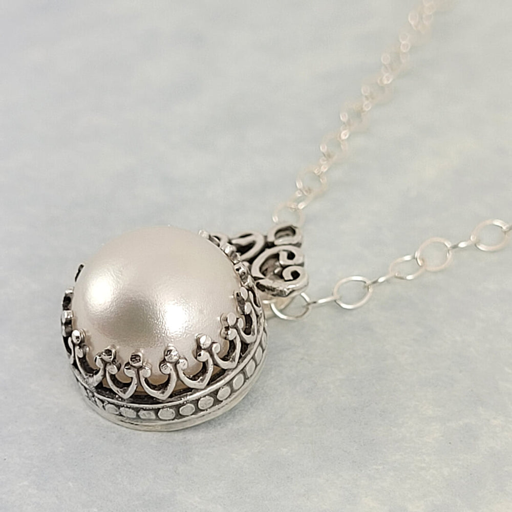 vintage style pearl pendant necklace with filigree detail in sterling silver