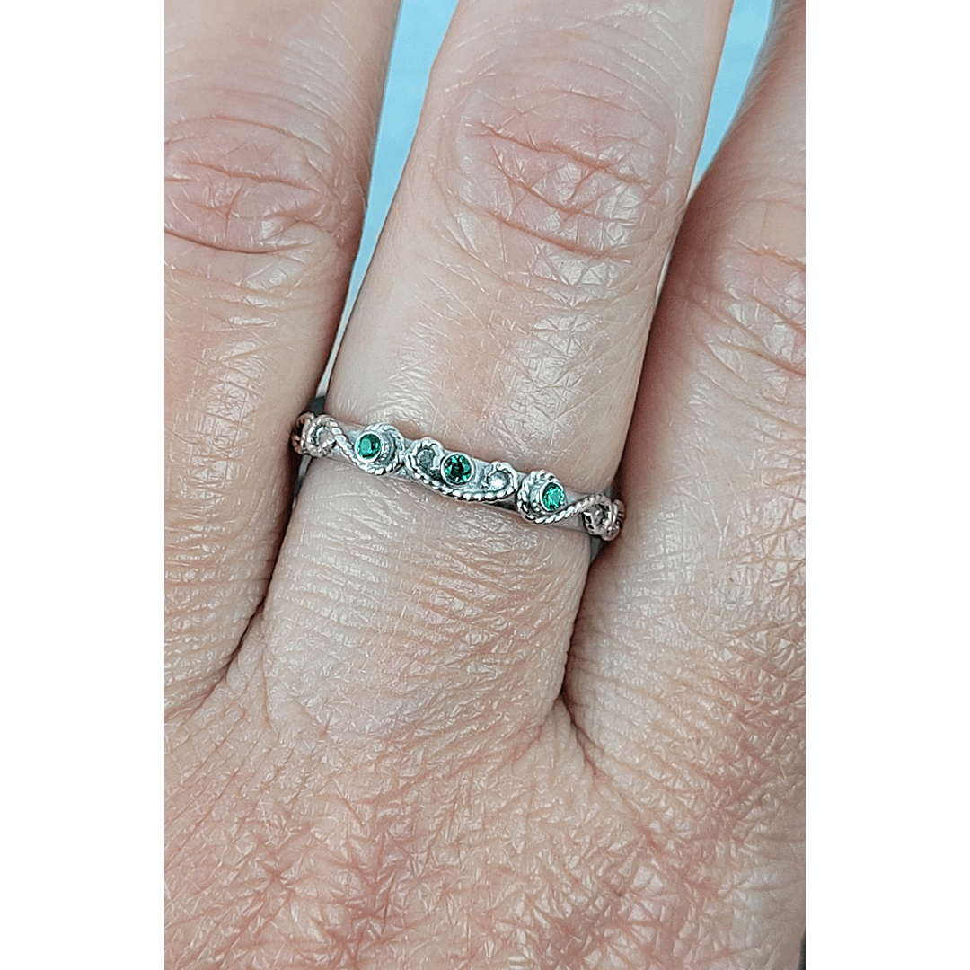 vintage-inspired scrollwork ring with emeralds in sterling silver