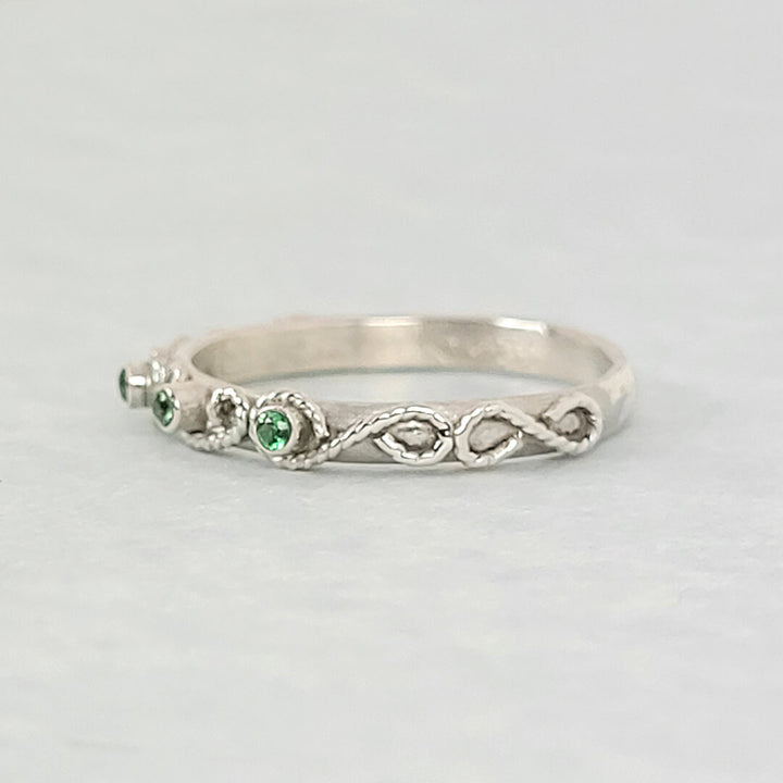vintage-inspired scrollwork ring with emeralds in sterling silver
