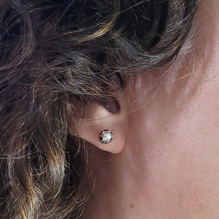 Edwardian vintage style petite pearl stud earrings in sterling silver on model