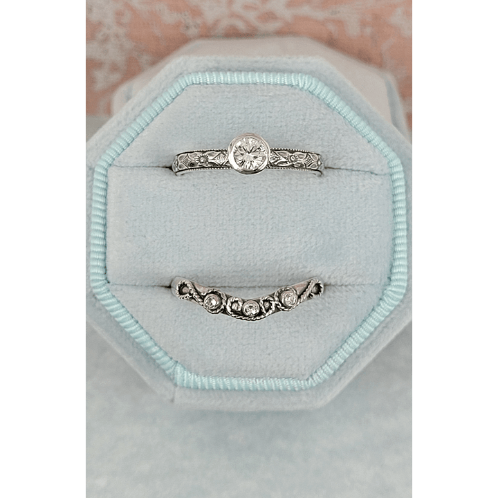 Vintage style white sapphire engagement ring and white sapphire scrollwork curved wedding band set in sterling silver in velvet box