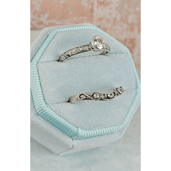 Vintage style white sapphire engagement ring and white sapphire scrollwork curved wedding band set in sterling silver